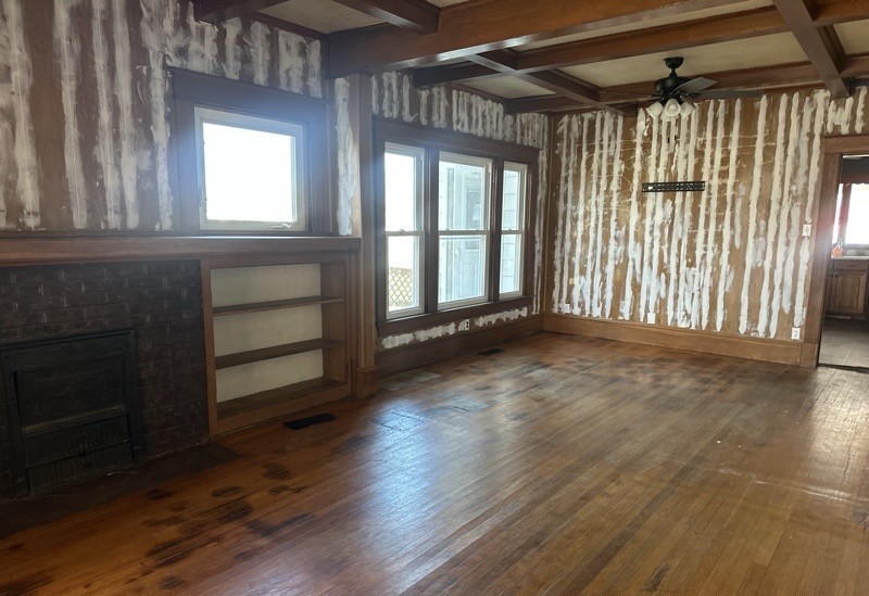 411 South Dean Street Royalton, IL 62983 - Photo 7 of 18 a view of an empty room with a window and wooden floor