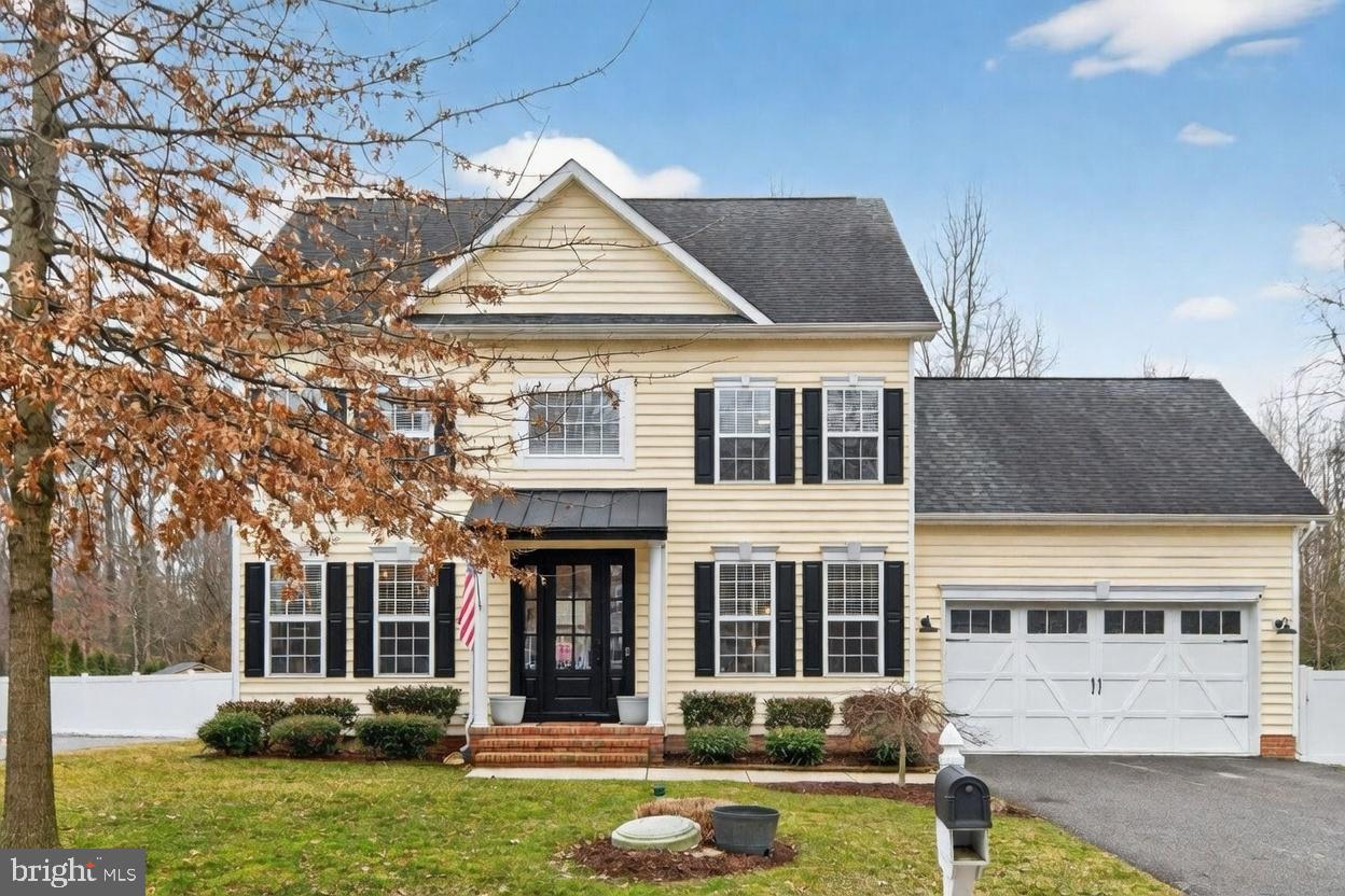 1409 James Way Edgewater, MD 21037 - Photo 1 of 21 a front view of a house with garden