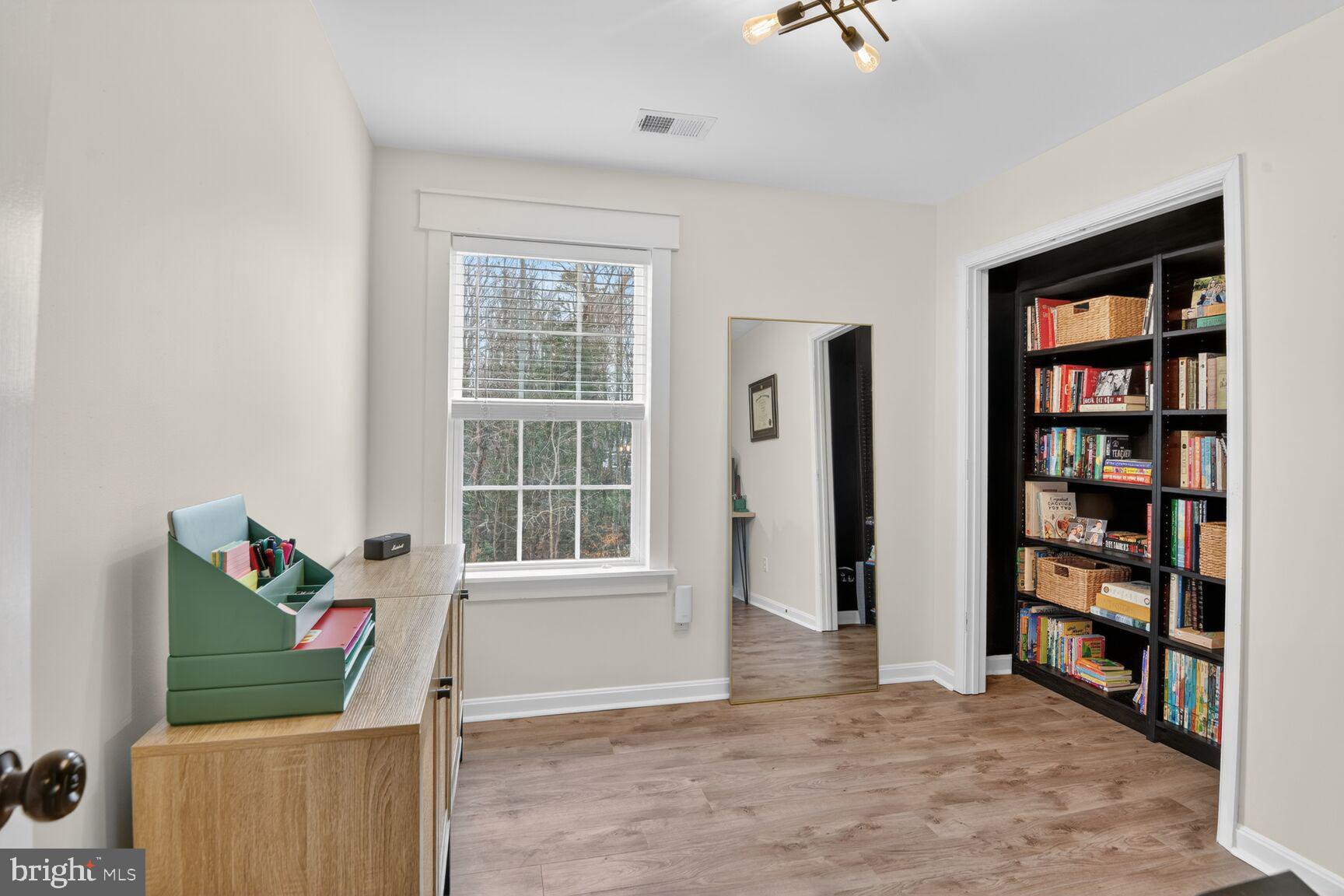 1409 James Way Edgewater, MD 21037 - Photo 12 of 21 wooden floor in an empty room with a window