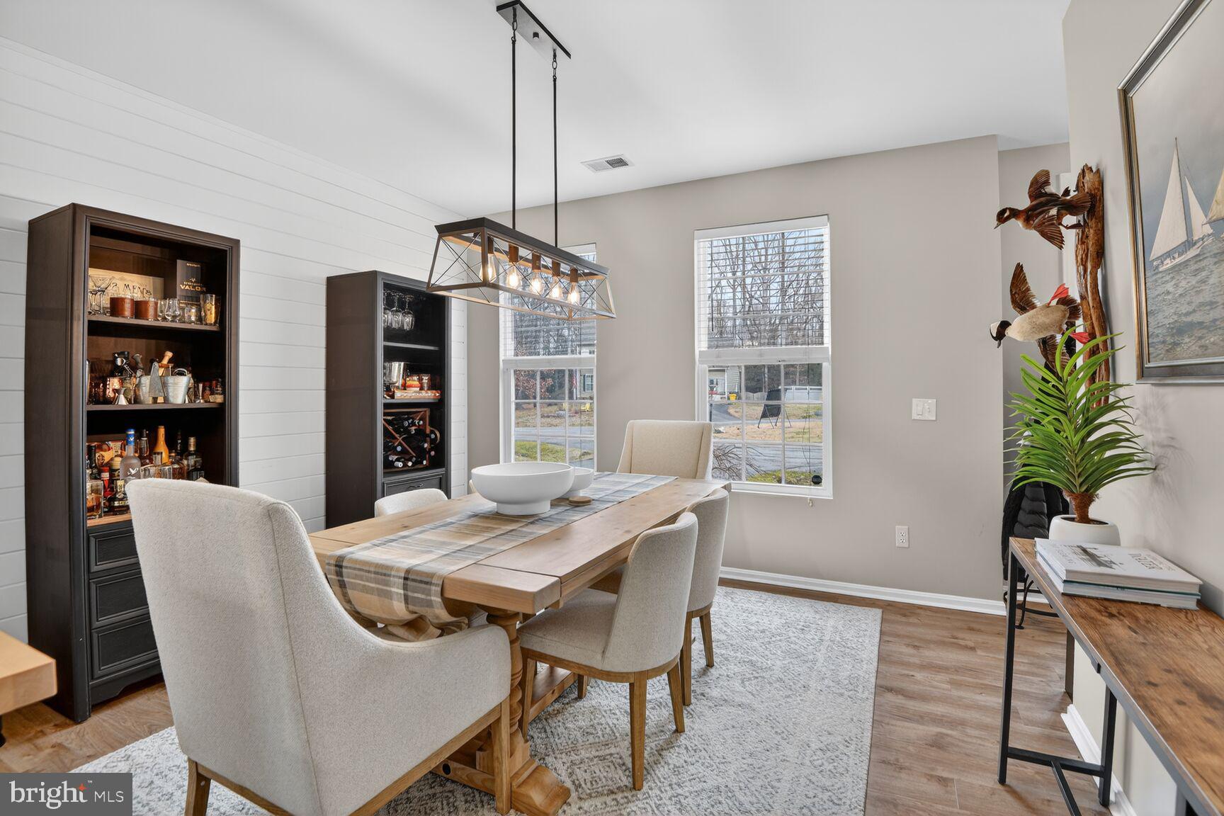 1409 James Way Edgewater, MD 21037 - Photo 4 of 21 a view of a dining room with furniture window and wooden floor