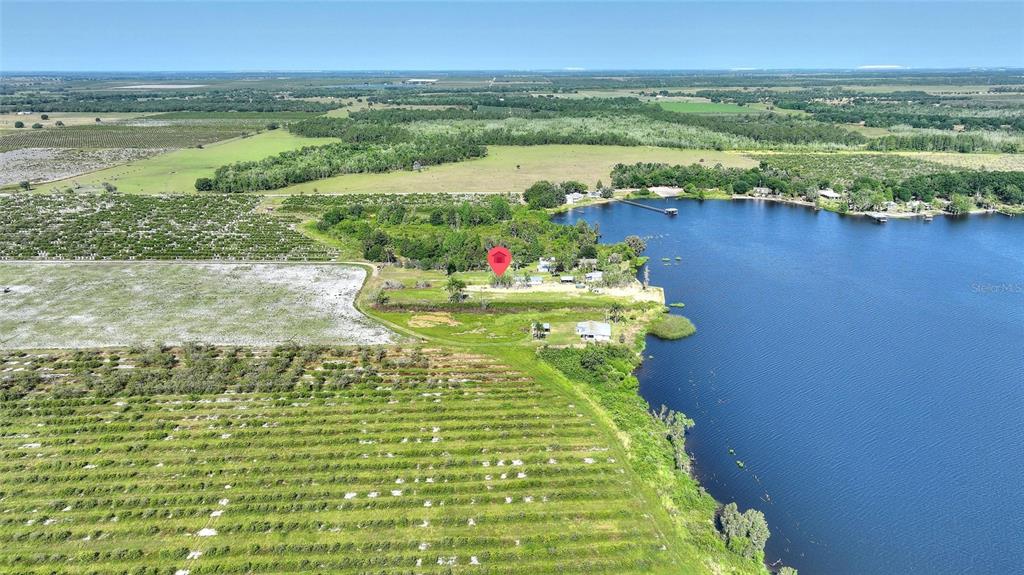 2427 Black Road Fort Meade, FL 33841 - Photo 12 of 26 a view of a lake with a mountain