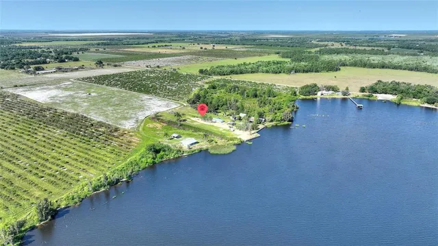 a view of a lake with a big yard