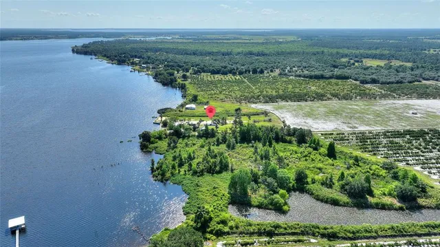 a view of a lake with a yard