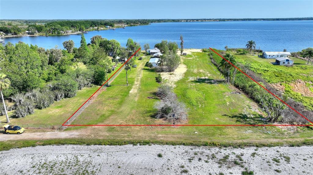 2427 Black Road Fort Meade, FL 33841 - Photo 20 of 26 a view of a lake with a big yard