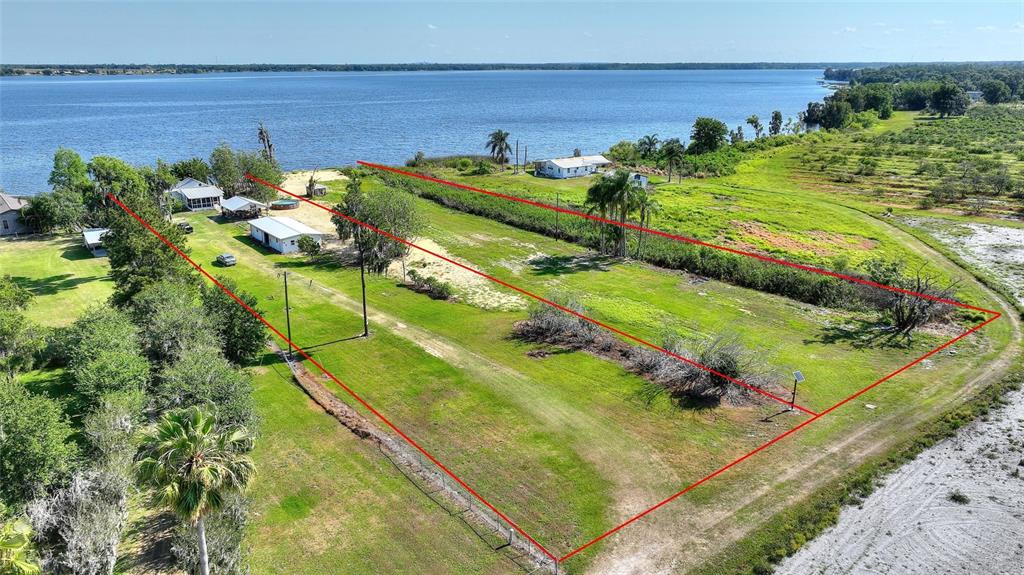 2427 Black Road Fort Meade, FL 33841 - Photo 2 of 26 a view of a yard with an outdoor space