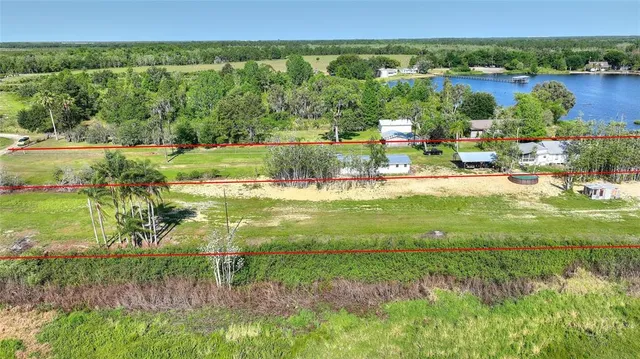 a view of a lake with a yard