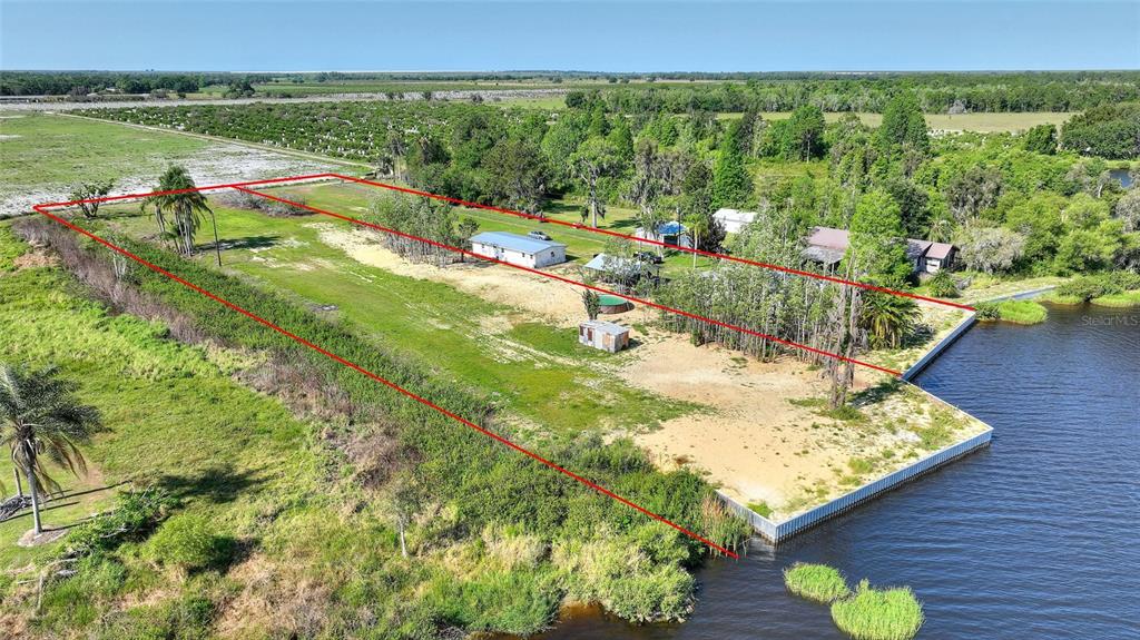 2427 Black Road Fort Meade, FL 33841 - Photo 7 of 26 a view of a lake from a balcony