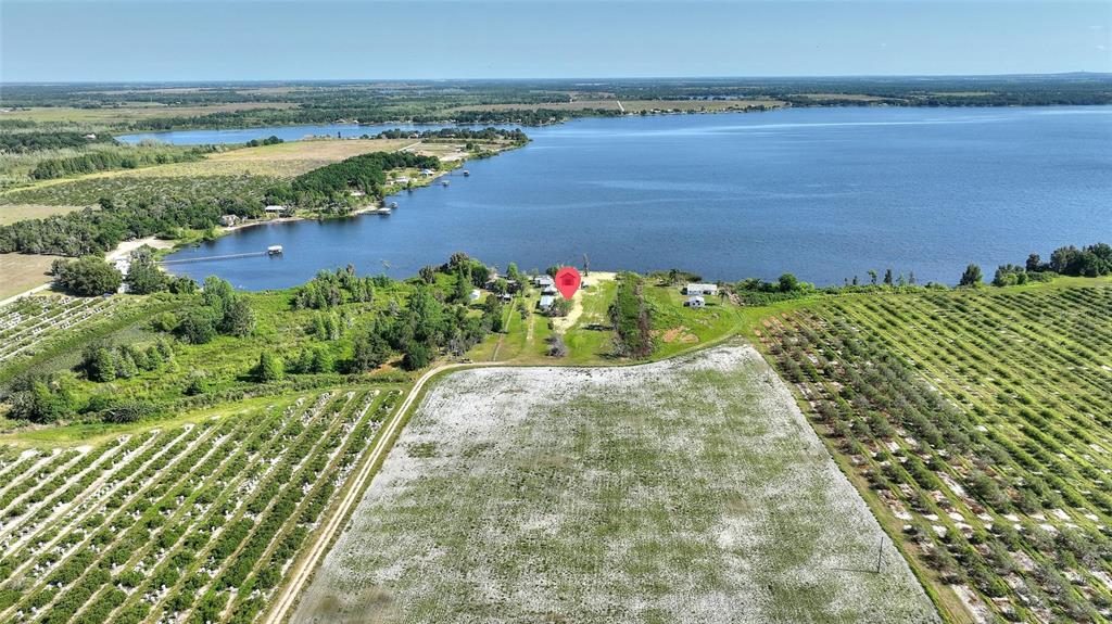 2427 Black Road Fort Meade, FL 33841 - Photo 10 of 26 a view of a lake with a yard