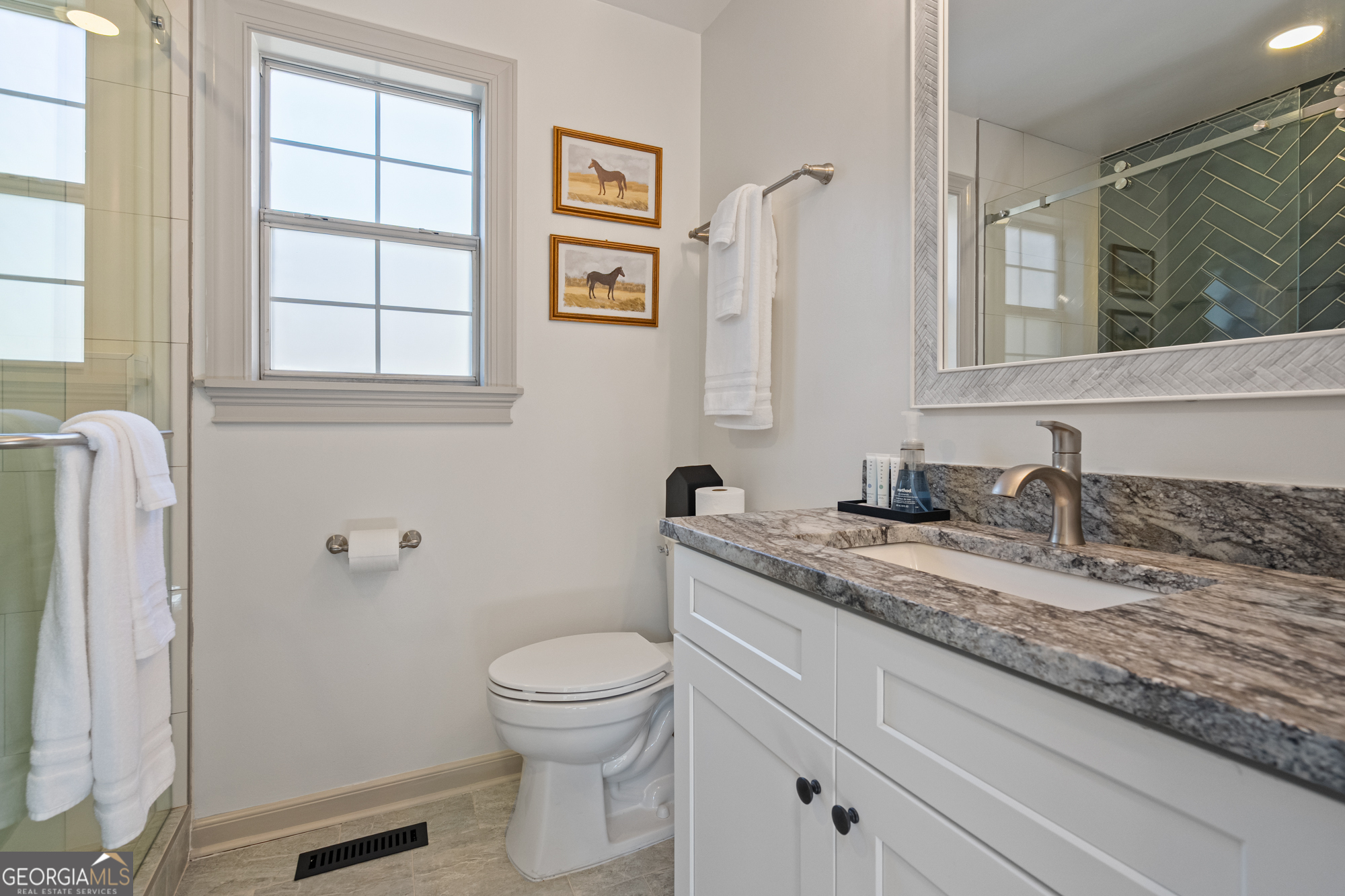 17 North Wesley Ridge Adairsville, GA 30103 - Photo 23 of 30 a bathroom with a granite countertop toilet sink and mirror