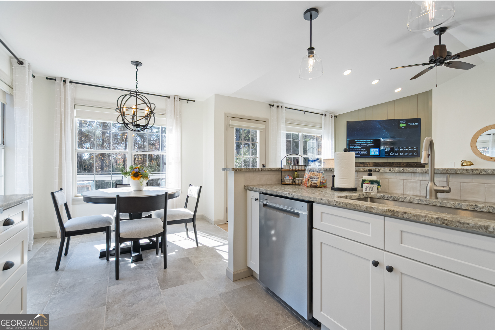 17 North Wesley Ridge Adairsville, GA 30103 - Photo 10 of 30 a open kitchen with stainless steel appliances granite countertop a sink a stove a dining table and chairs