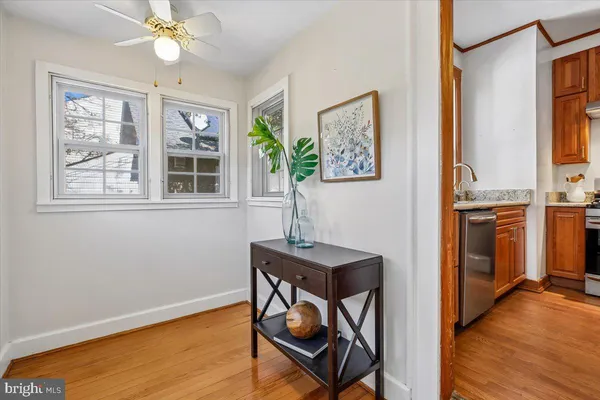 a living room with furniture and large windows