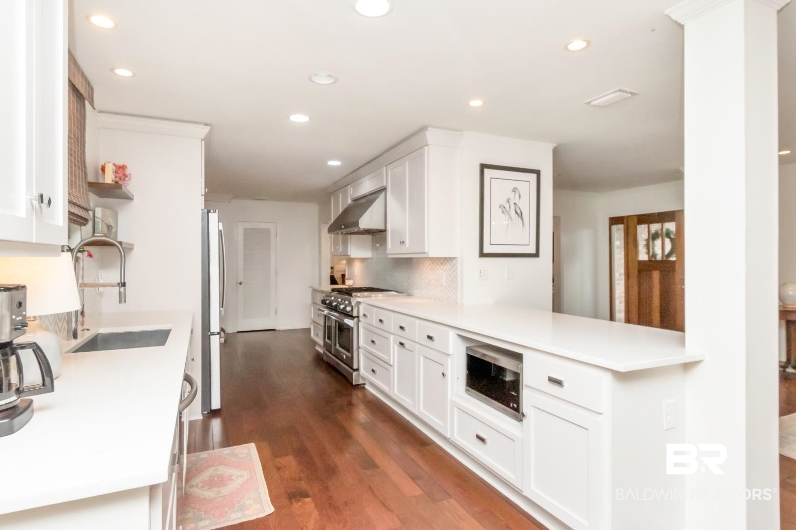 154 Fenwick Road Mobile, AL 36608 - Photo 15 of 48 Kitchen with white cabinets, dark wood-type flooring, stainless steel appliances, recessed lighting, and extractor fan