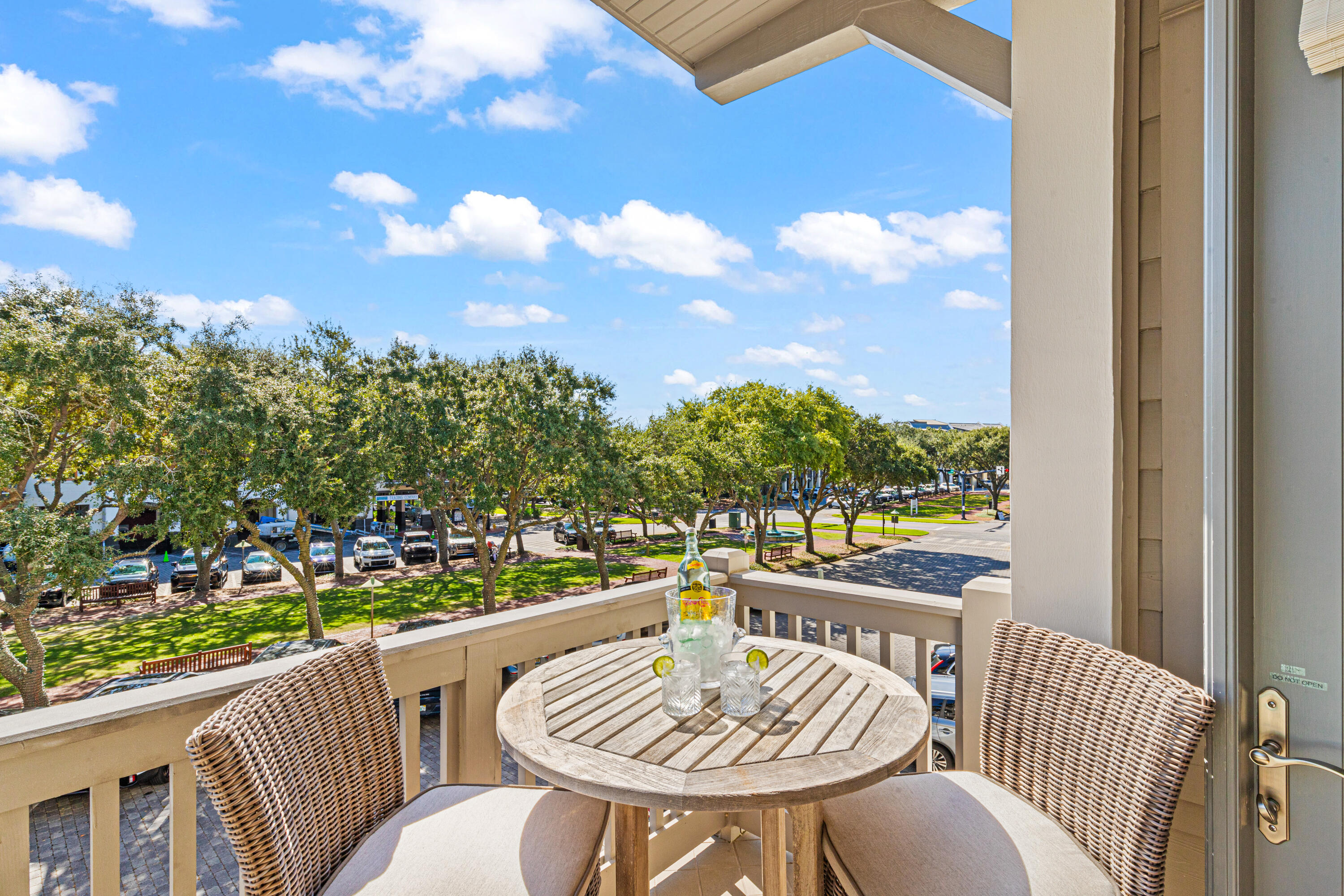 a view of a chairs and table in the balcony