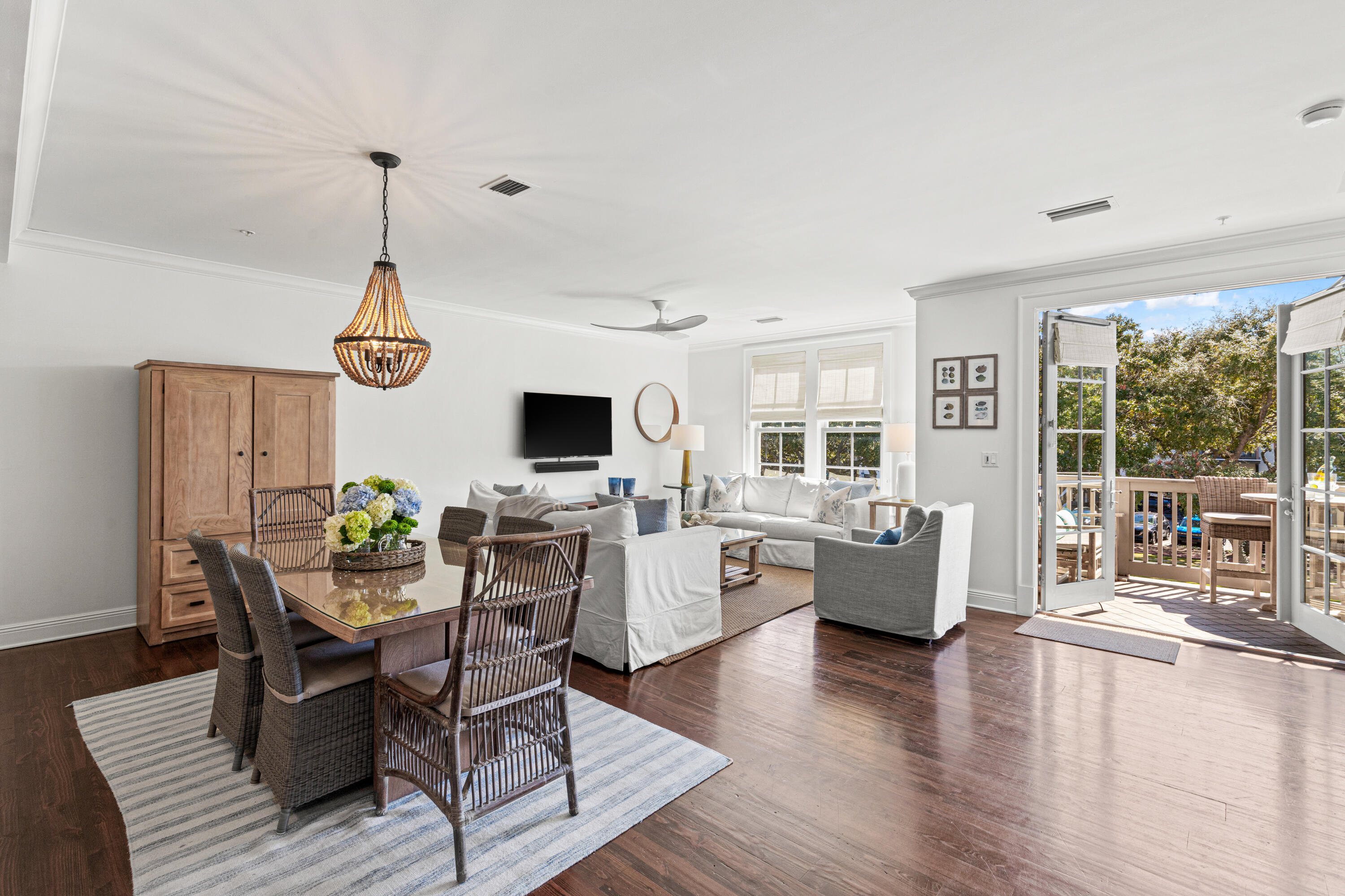 104 North Barrett Square, Unit 2A Inlet Beach, FL 32461 - Photo 11 of 44 a view of a dining room with furniture window and wooden floor