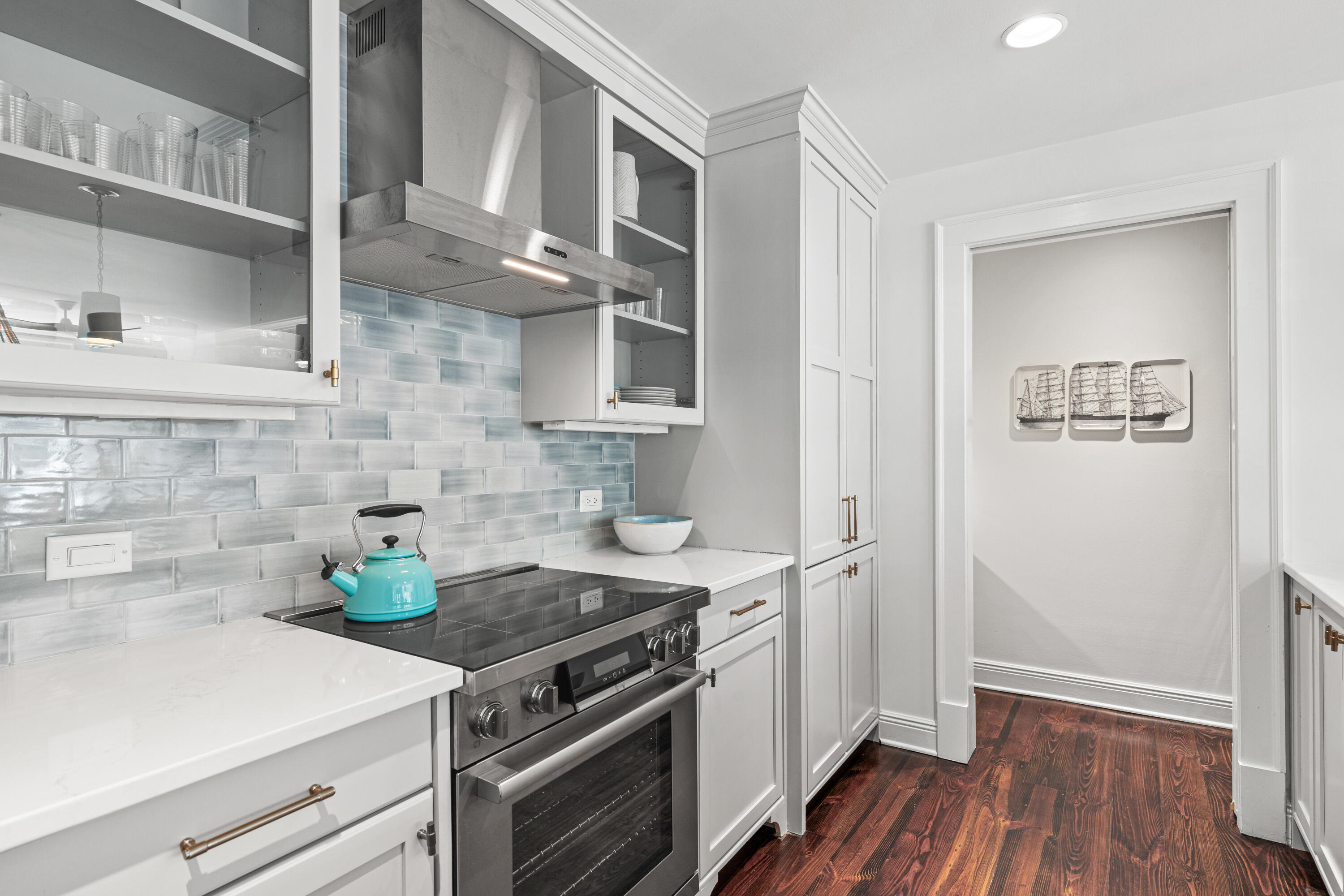 104 North Barrett Square, Unit 2A Inlet Beach, FL 32461 - Photo 17 of 44 a kitchen with a stove and wooden floor