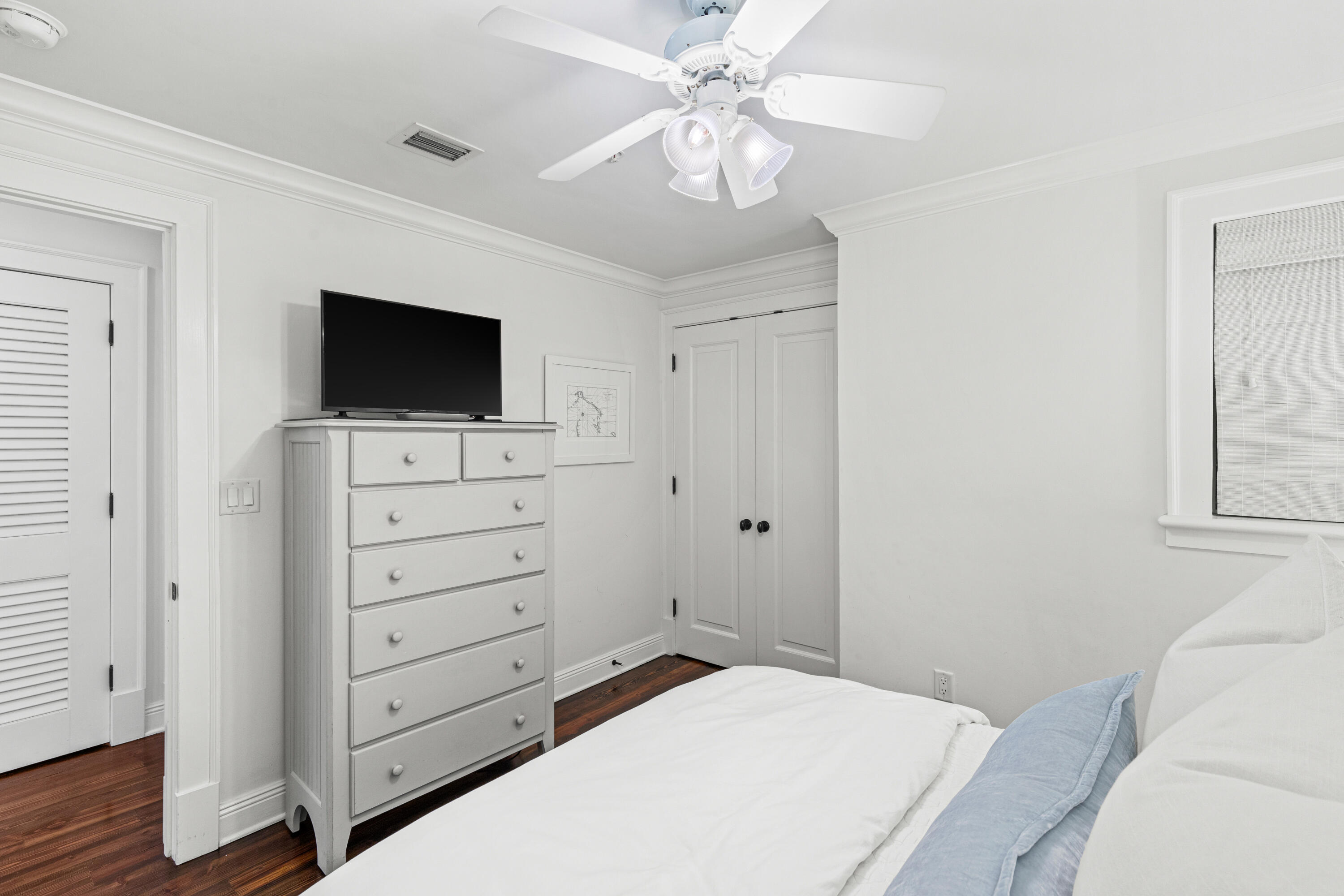 104 North Barrett Square, Unit 2A Inlet Beach, FL 32461 - Photo 31 of 44 a bedroom with a bed and a flat tv screen on dresser