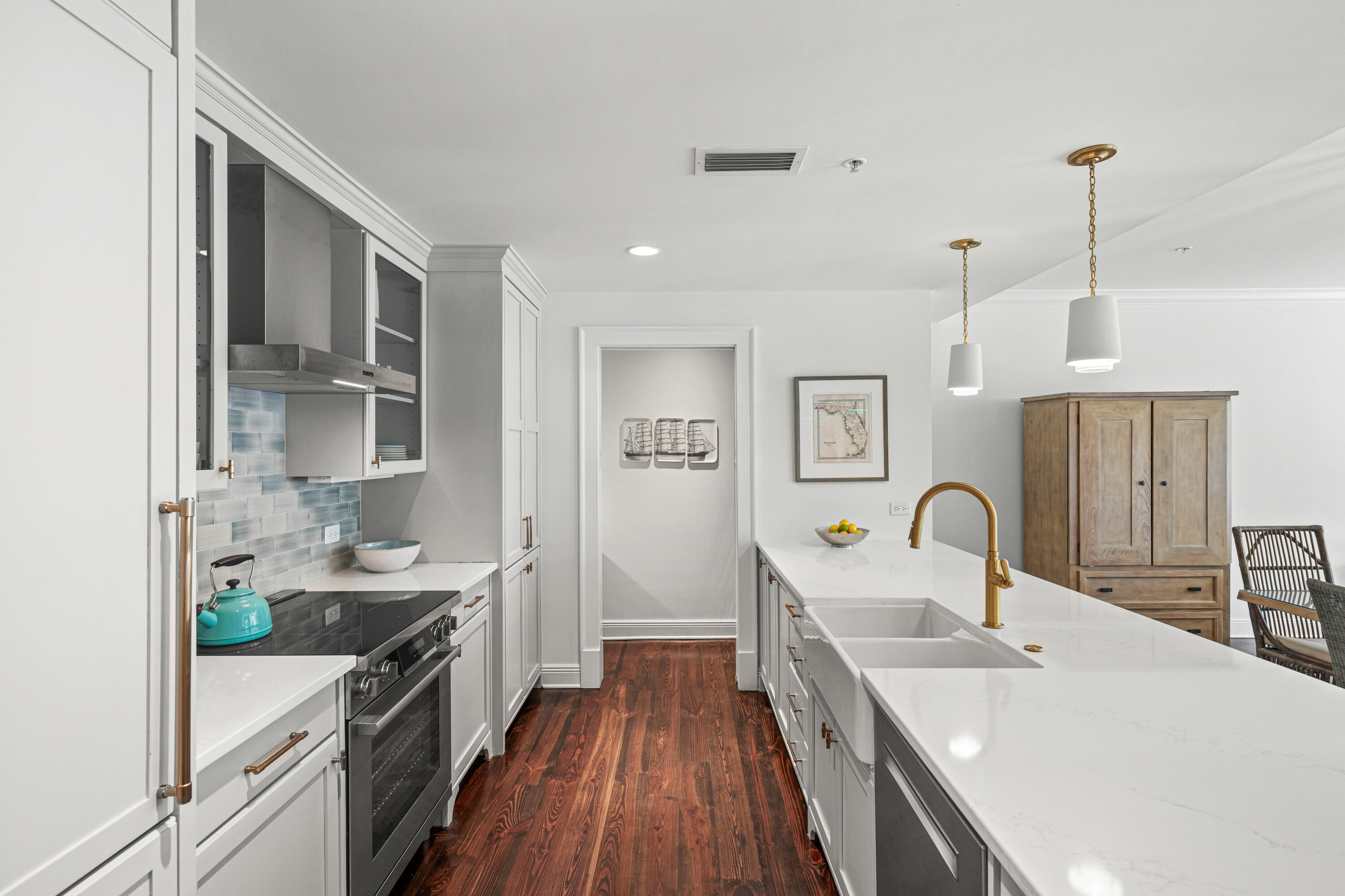 104 North Barrett Square, Unit 2A Inlet Beach, FL 32461 - Photo 8 of 44 a kitchen with stainless steel appliances a sink stove and refrigerator