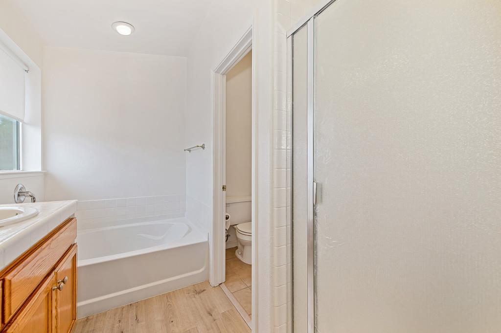 3524 Riojo Way Rancho Cordova, CA 95670 - Photo 37 of 47 a bathroom with a bathtub and a shower