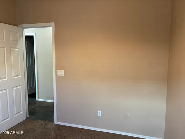 an empty room with a empty space and windows