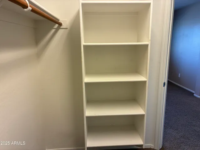 a bathroom with a granite countertop sink a mirror and a vanity
