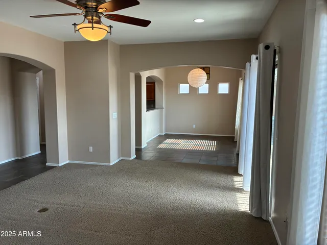 a view of a livingroom with a ceiling fan