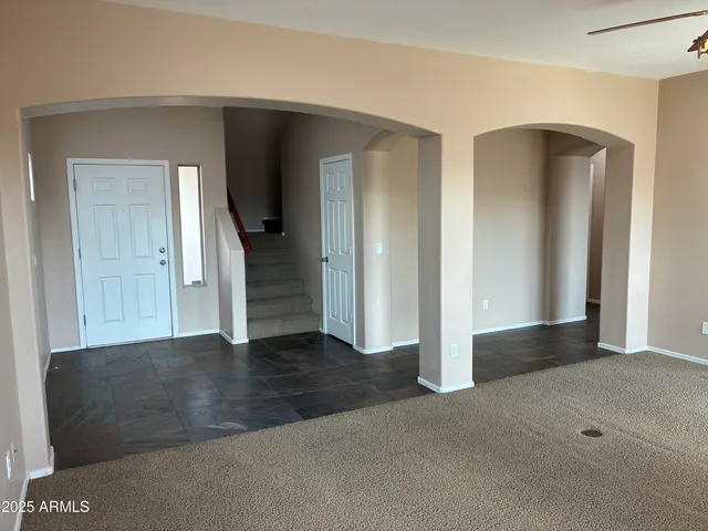 an empty room with closet and wooden floor