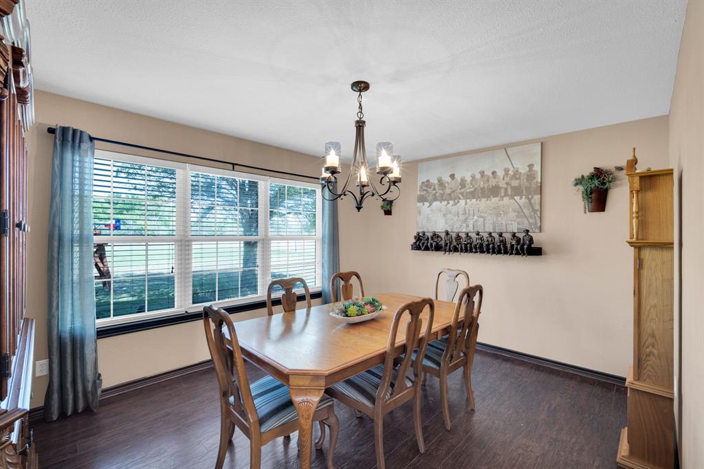 130 Eubanks Road Maypearl, TX 76064 - Photo 16 of 39 a dining room with furniture a chandelier and window