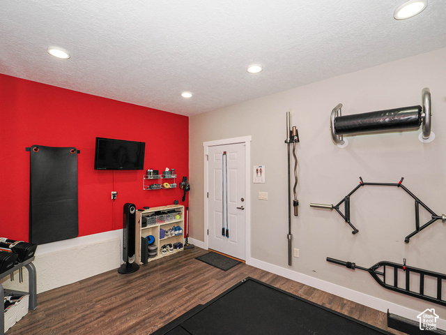 3308 Willow Ridge Road Salt Lake City, UT 84121 - Photo 55 of 59 Recessed lighting, wood-finish flooring, white trim, and a white paneled door