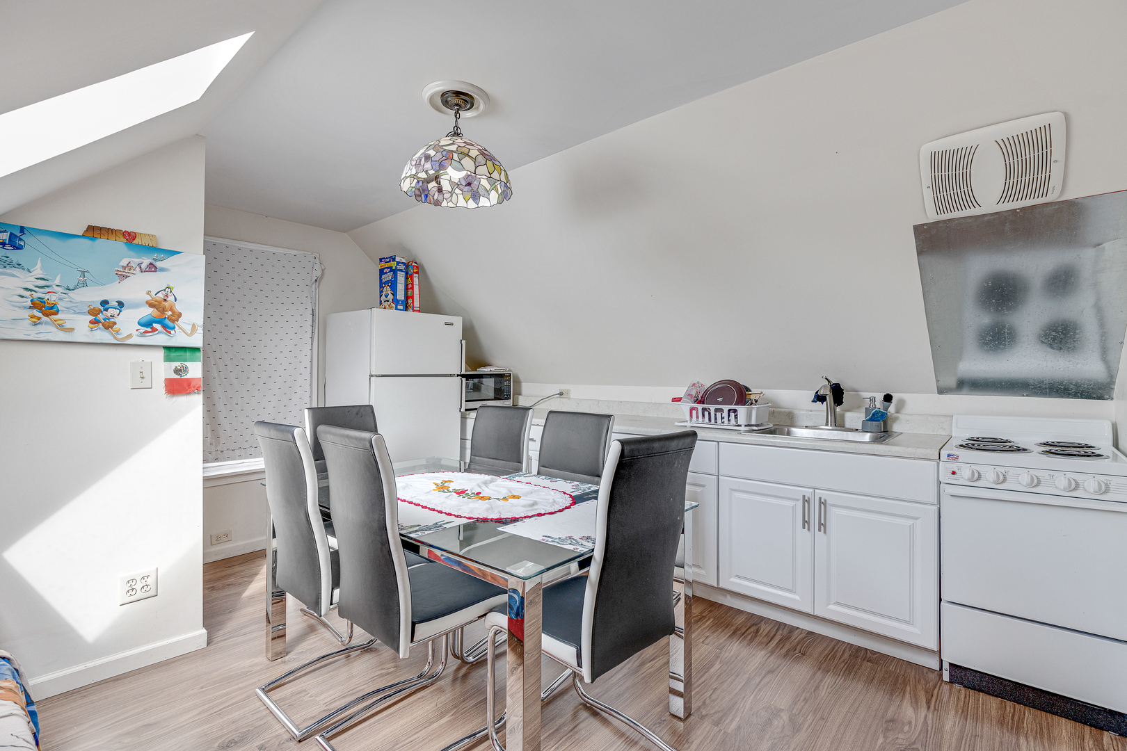 2135 North Menard Avenue, Unit 3 Chicago, IL 60639 - Photo 2 of 12 a view of a dining room with furniture and wooden floor