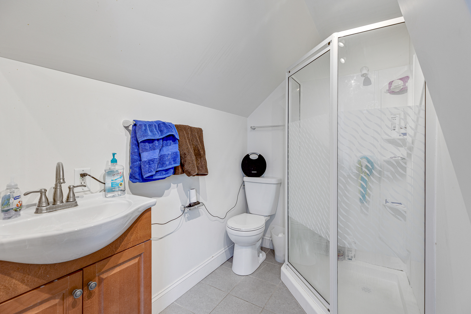 2135 North Menard Avenue, Unit 3 Chicago, IL 60639 - Photo 3 of 12 a bathroom with a sink toilet and shower