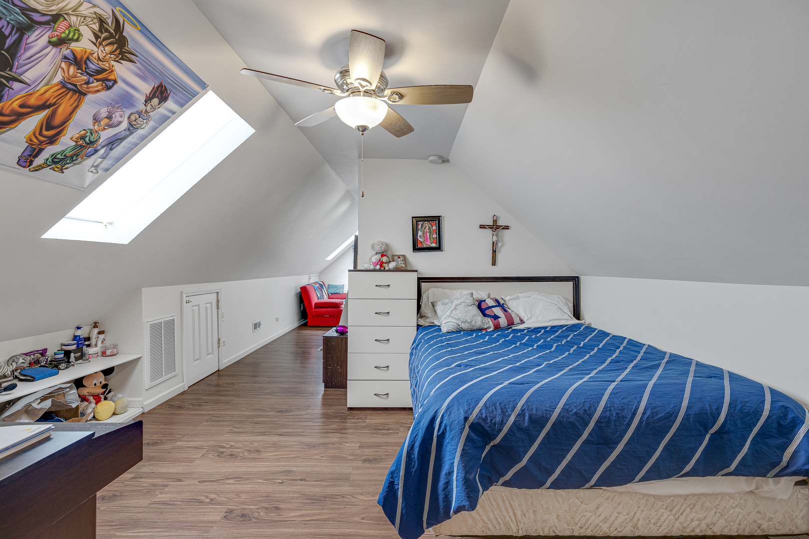 2135 North Menard Avenue, Unit 3 Chicago, IL 60639 - Photo 6 of 12 a bedroom with a bed and wooden floor