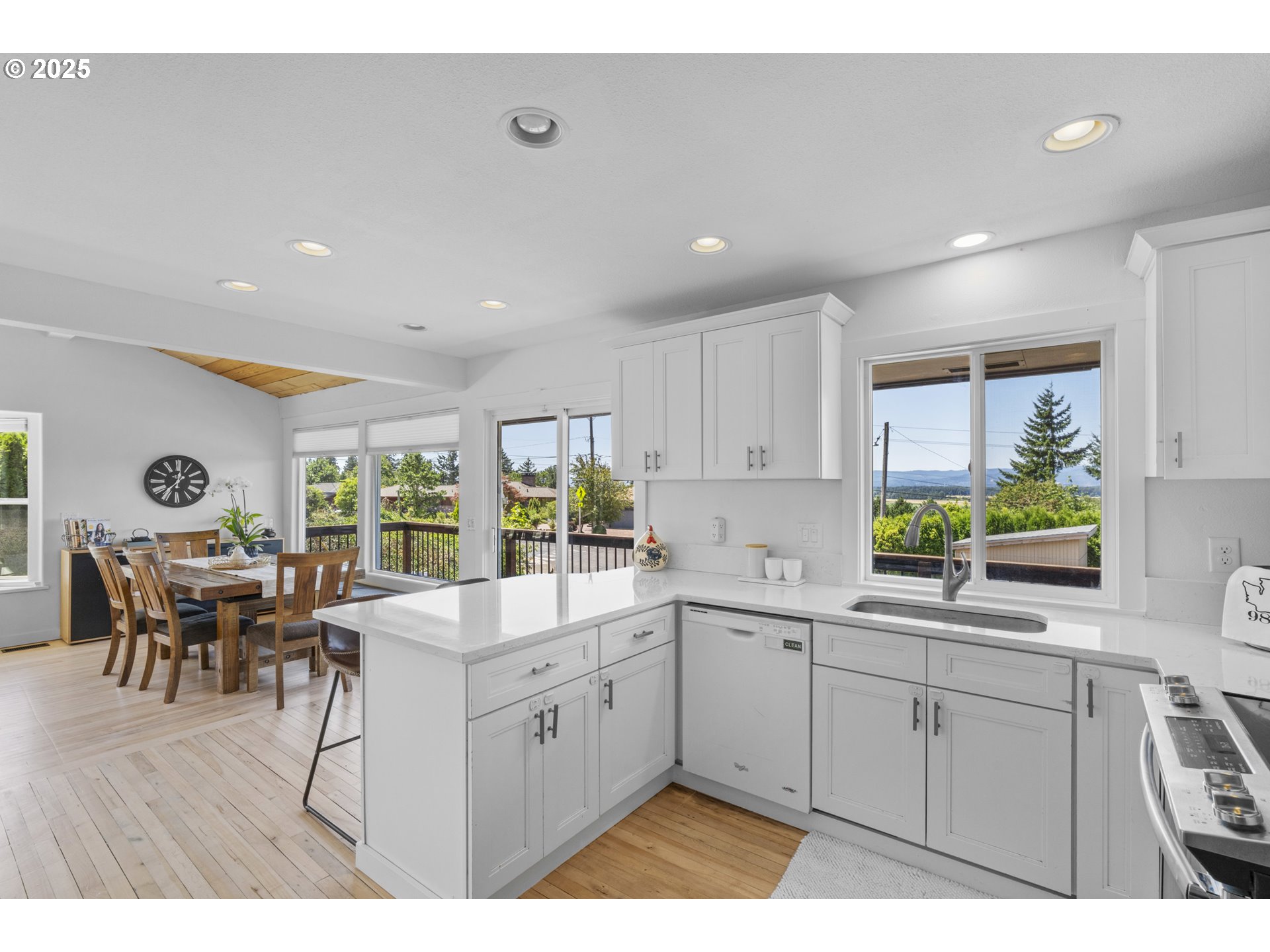470 South 9th Court Ridgefield, WA 98642 - Photo 12 of 47 a kitchen with a sink cabinets and dining table
