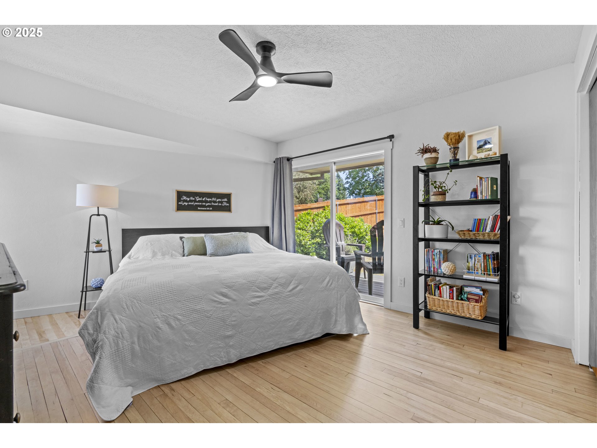 470 South 9th Court Ridgefield, WA 98642 - Photo 20 of 47 a bedroom with a bed a dresser and a book shelf
