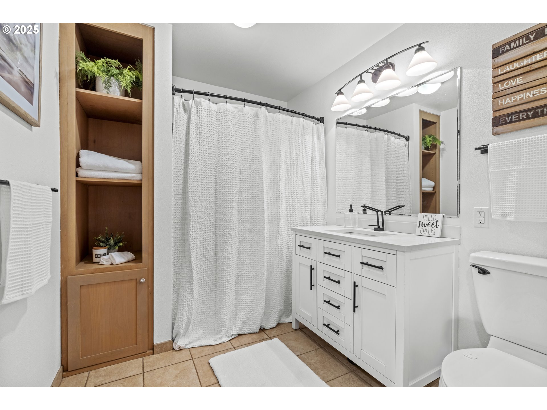 470 South 9th Court Ridgefield, WA 98642 - Photo 22 of 47 a bathroom with a sink a mirror and a toilet