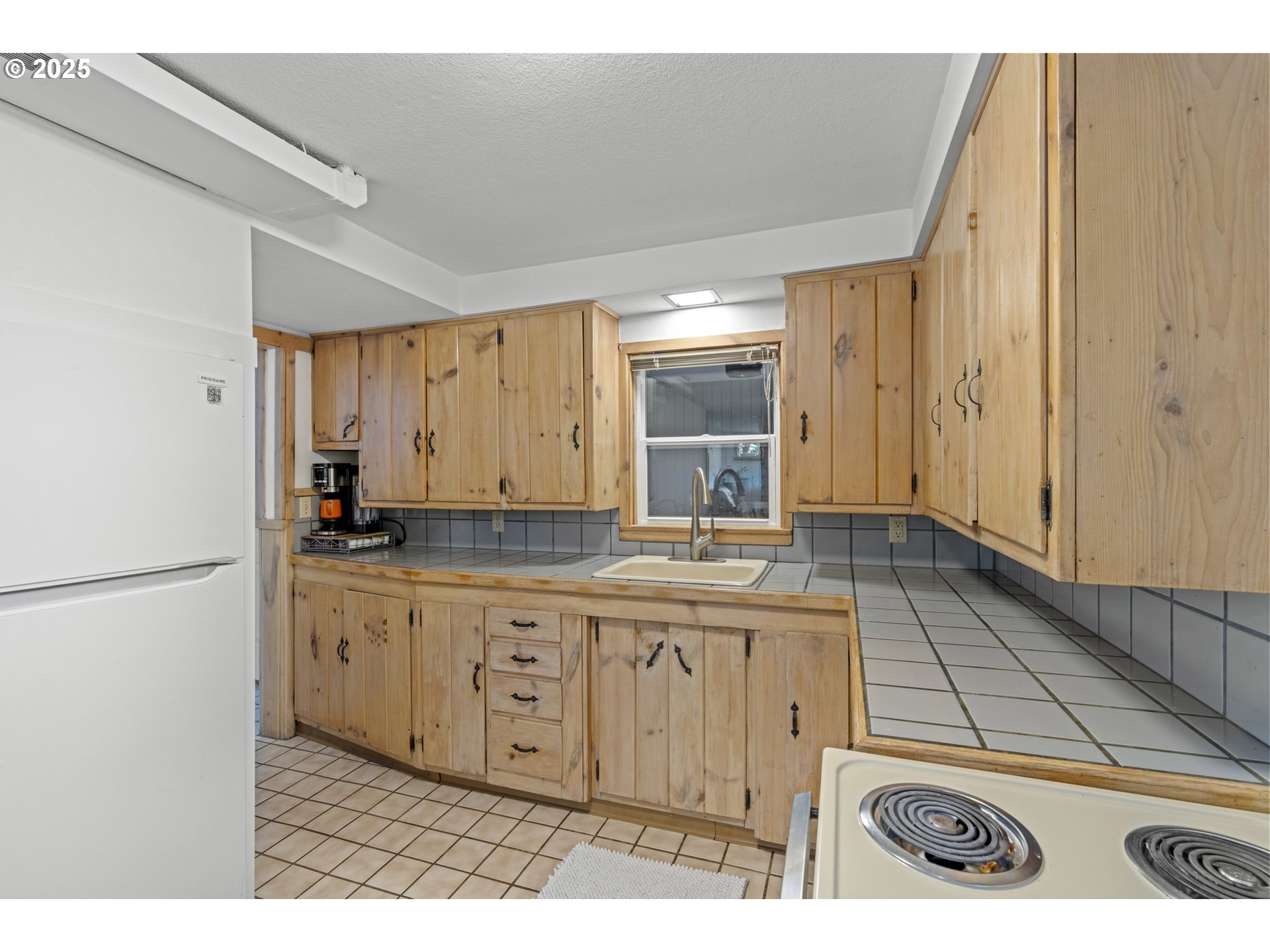470 South 9th Court Ridgefield, WA 98642 - Photo 30 of 47 a kitchen with a sink and cabinets