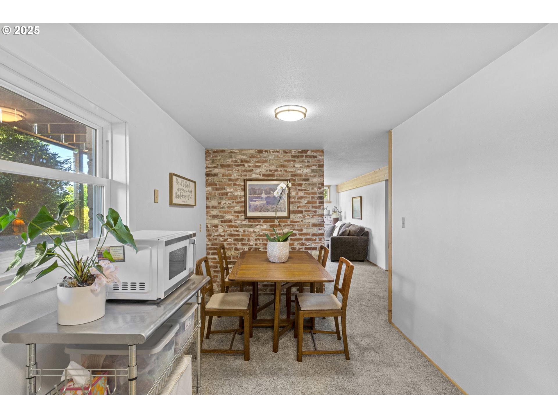 470 South 9th Court Ridgefield, WA 98642 - Photo 31 of 47 a view of a dining room with furniture and a potted plant