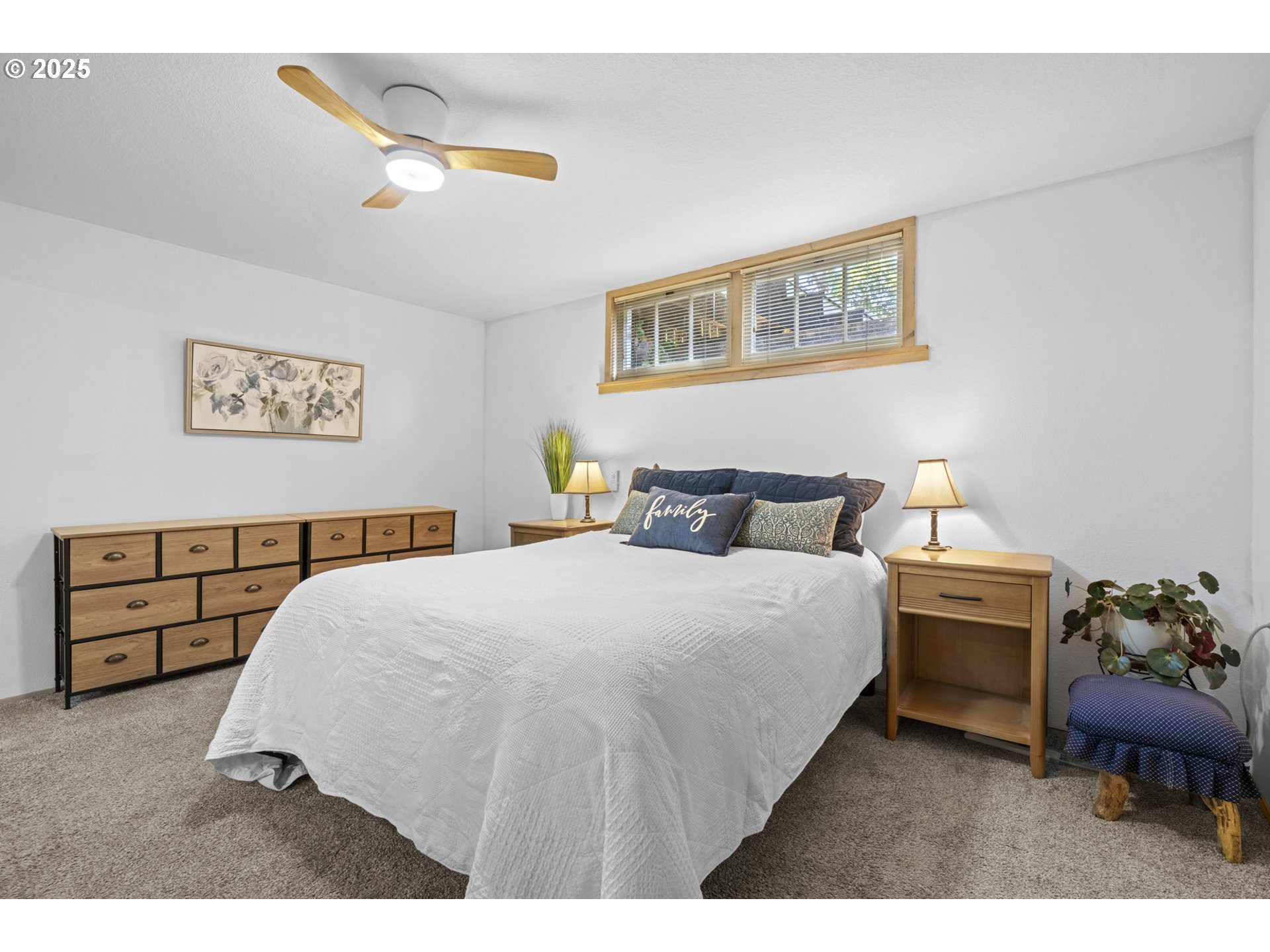 470 South 9th Court Ridgefield, WA 98642 - Photo 32 of 47 a bedroom with a bed and a painting on the wall