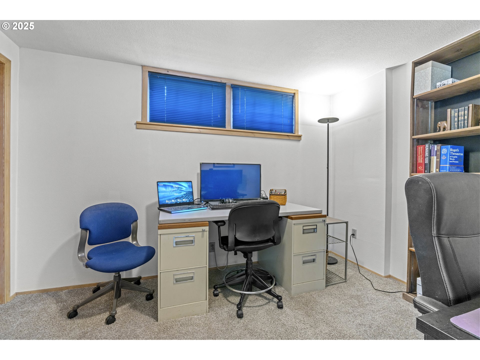470 South 9th Court Ridgefield, WA 98642 - Photo 35 of 47 a workspace with furniture and a bookshelf