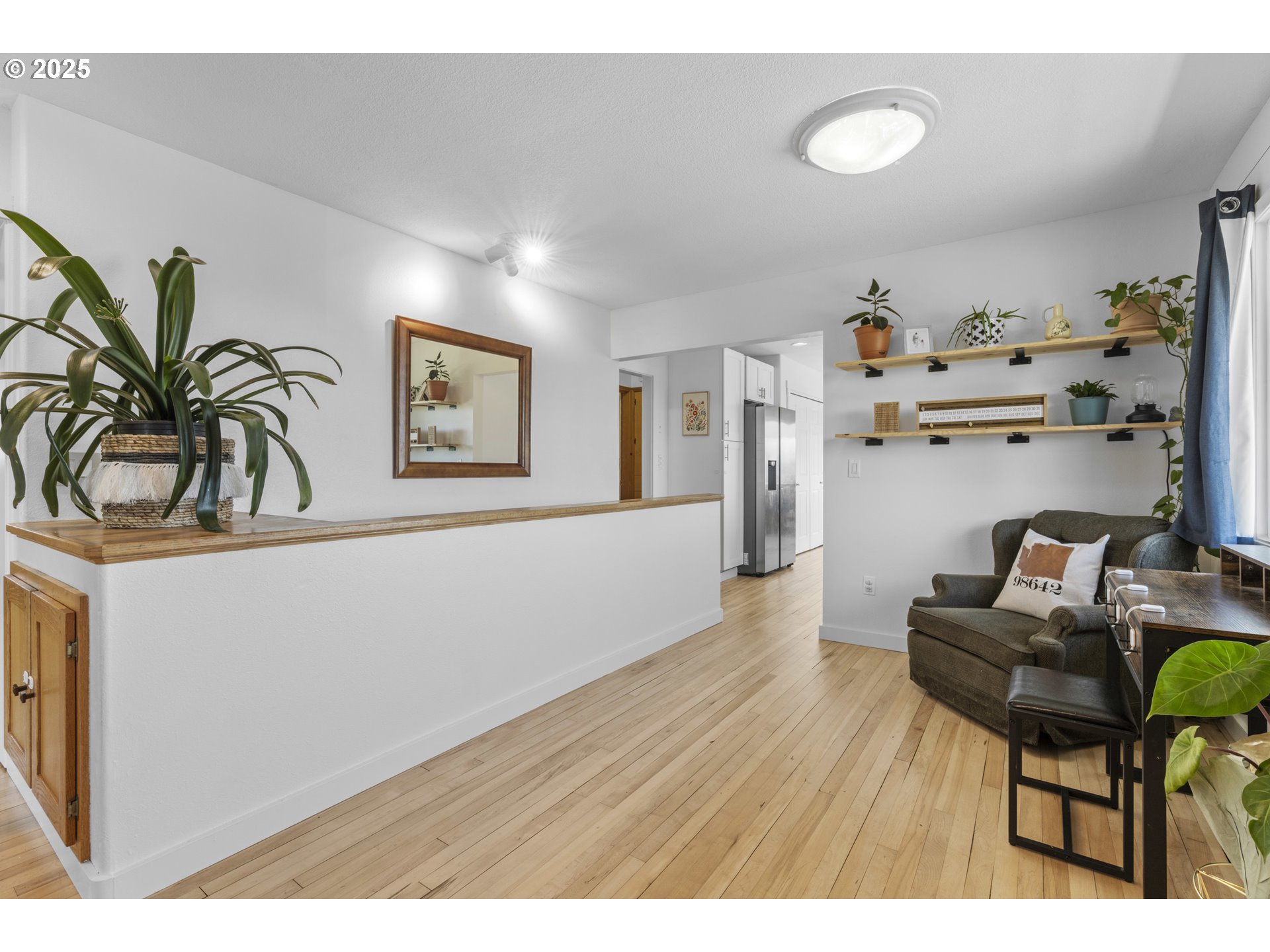 470 South 9th Court Ridgefield, WA 98642 - Photo 6 of 47 a living room with furniture and a wooden floor