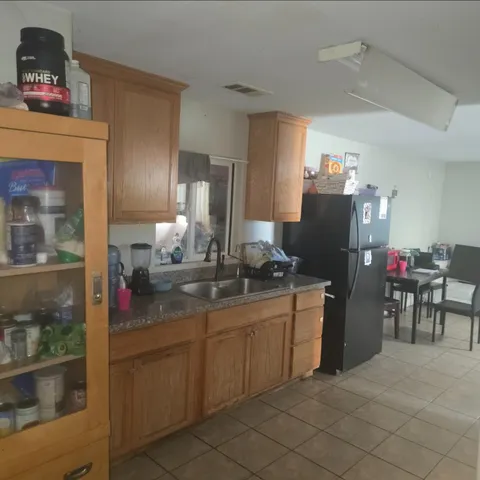 a kitchen with a sink and cabinets