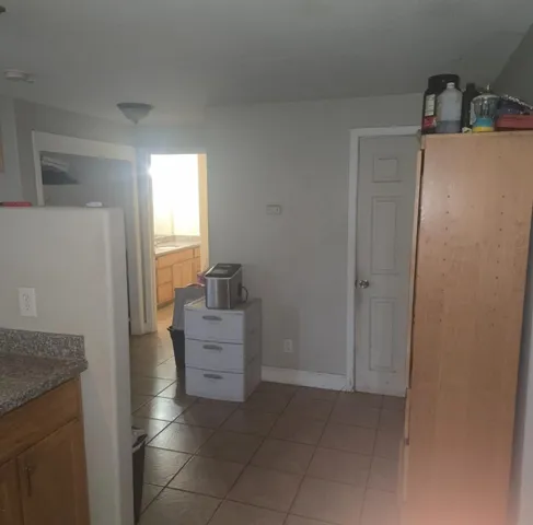a room with cabinets and a dresser