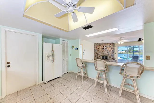 a view of a dining room with furniture and a chandelier