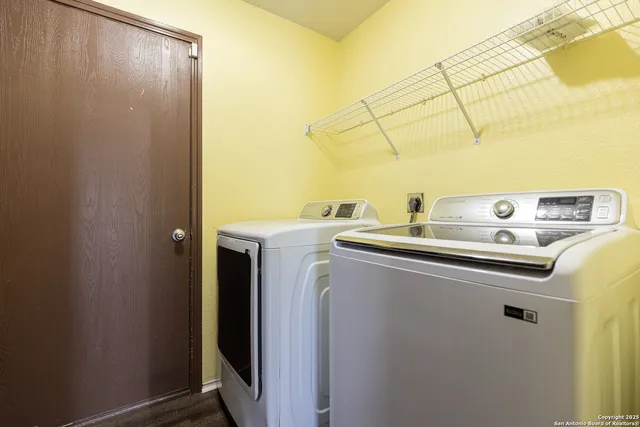 a utility room with dryer and washer