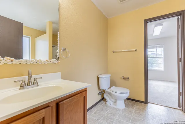 a bathroom with a sink and a toilet
