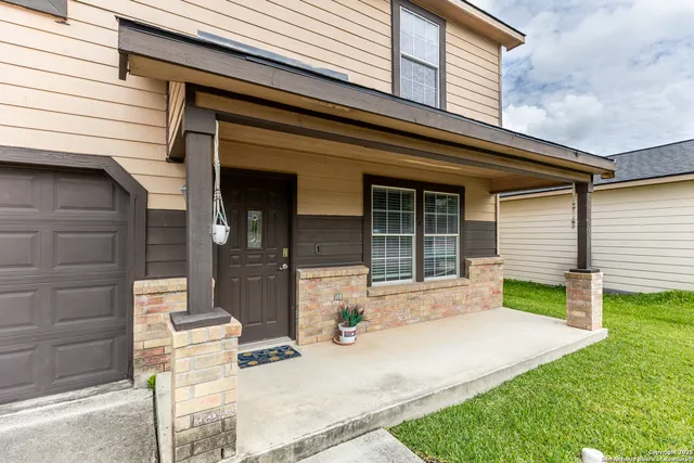 a front view of a house with a patio