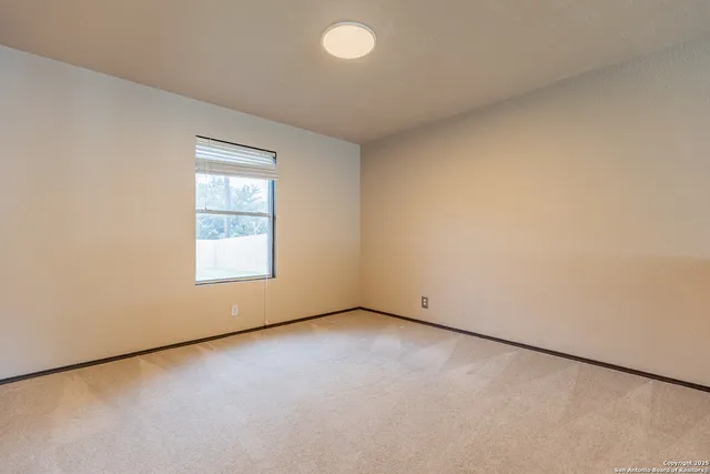 an empty room with a empty space and a window