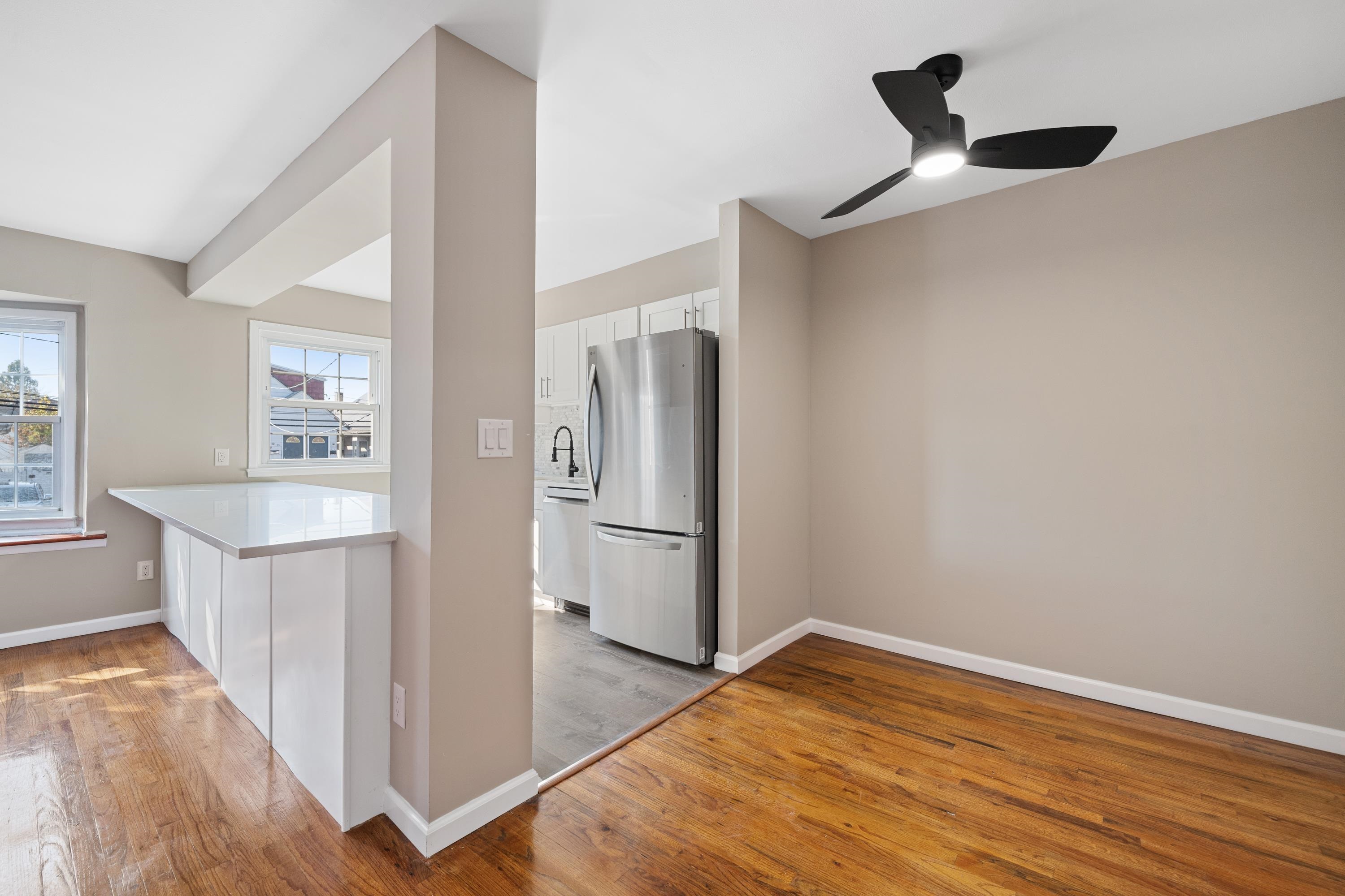 14 Delmar Road Jersey City, NJ 07305 - Photo 12 of 38 a view of kitchen with a sink refrigerator and wooden floor