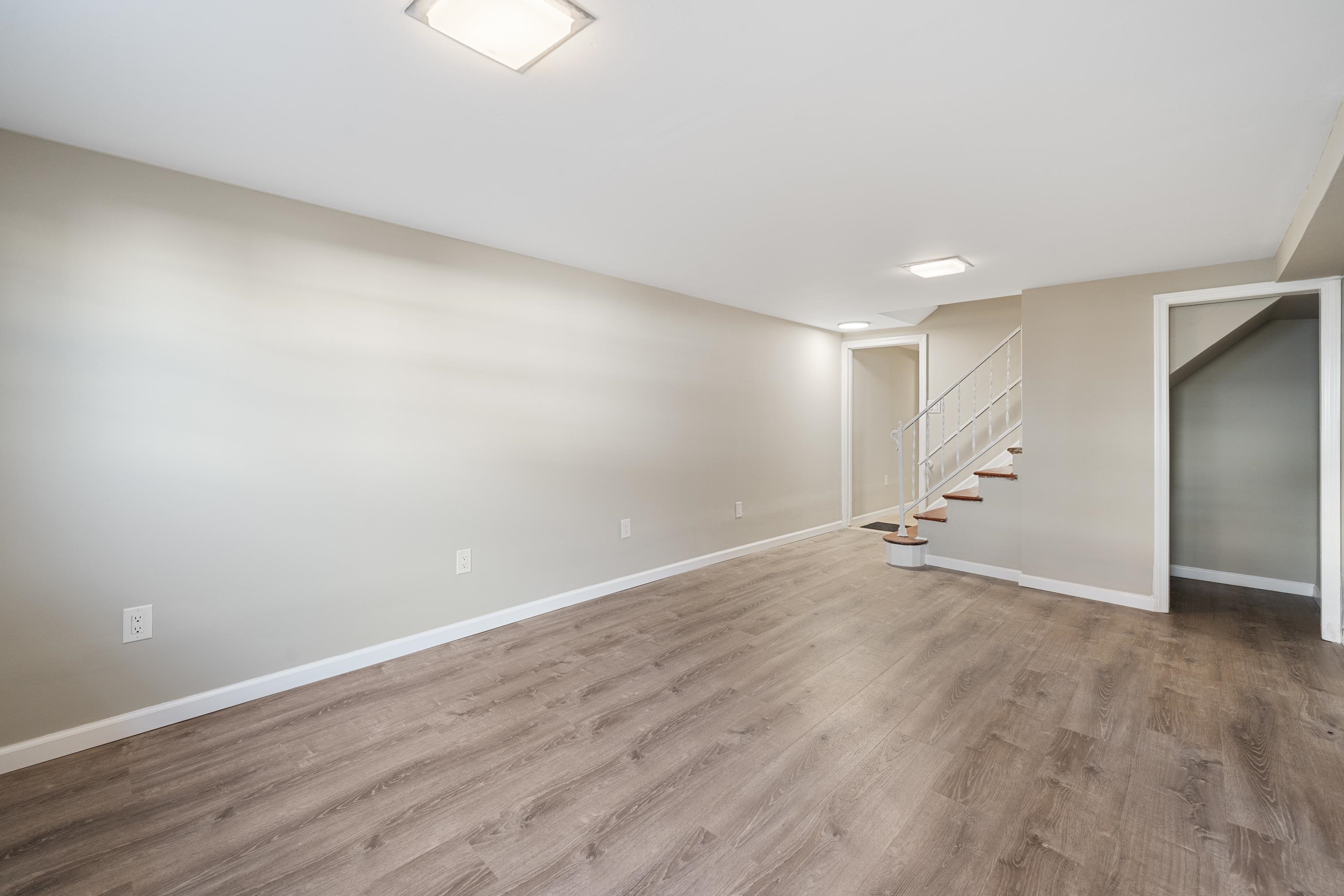 14 Delmar Road Jersey City, NJ 07305 - Photo 17 of 38 a view of an empty room with wooden floor
