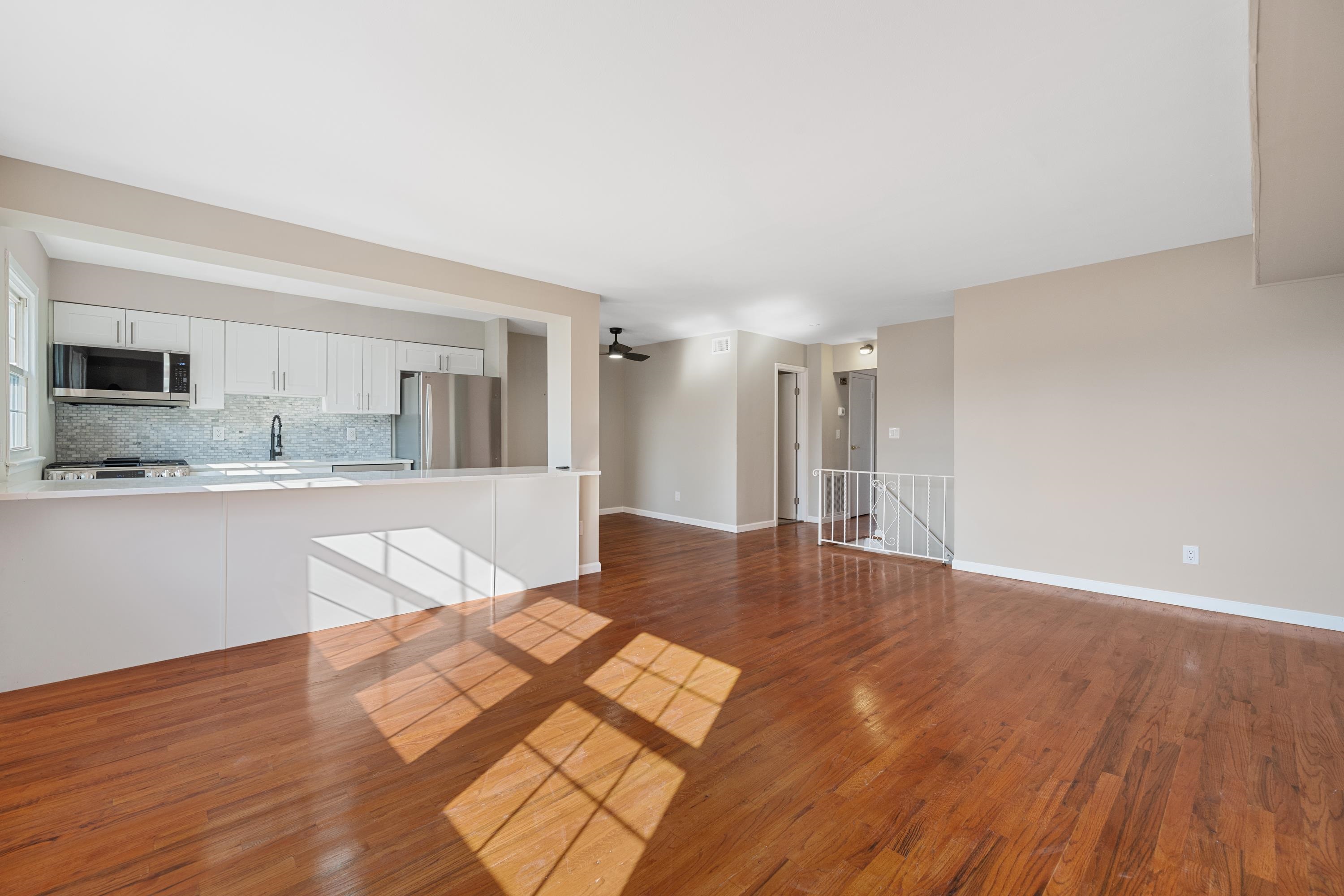 14 Delmar Road Jersey City, NJ 07305 - Photo 25 of 38 a view of kitchen with granite countertop cabinets and wooden floor