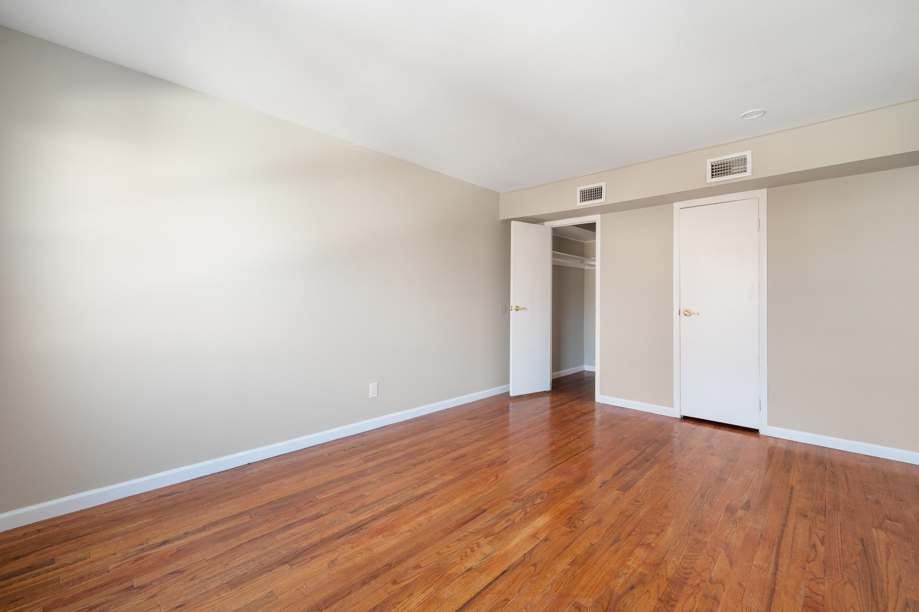 14 Delmar Road Jersey City, NJ 07305 - Photo 32 of 38 a view of an empty room with wooden floor and closet